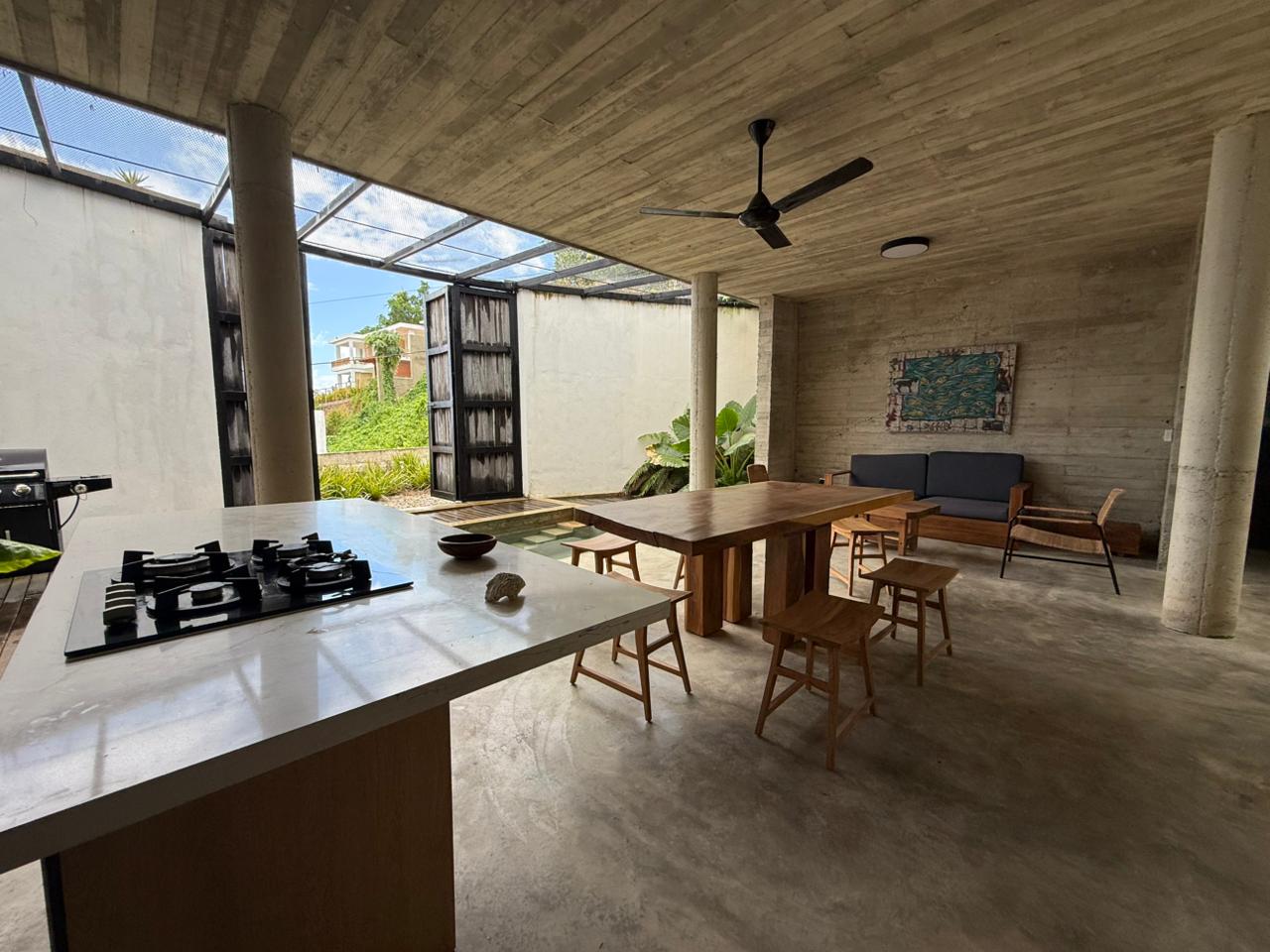 Designer Brutalist Villa with Interior Pool & Introspective Tropical Architecture